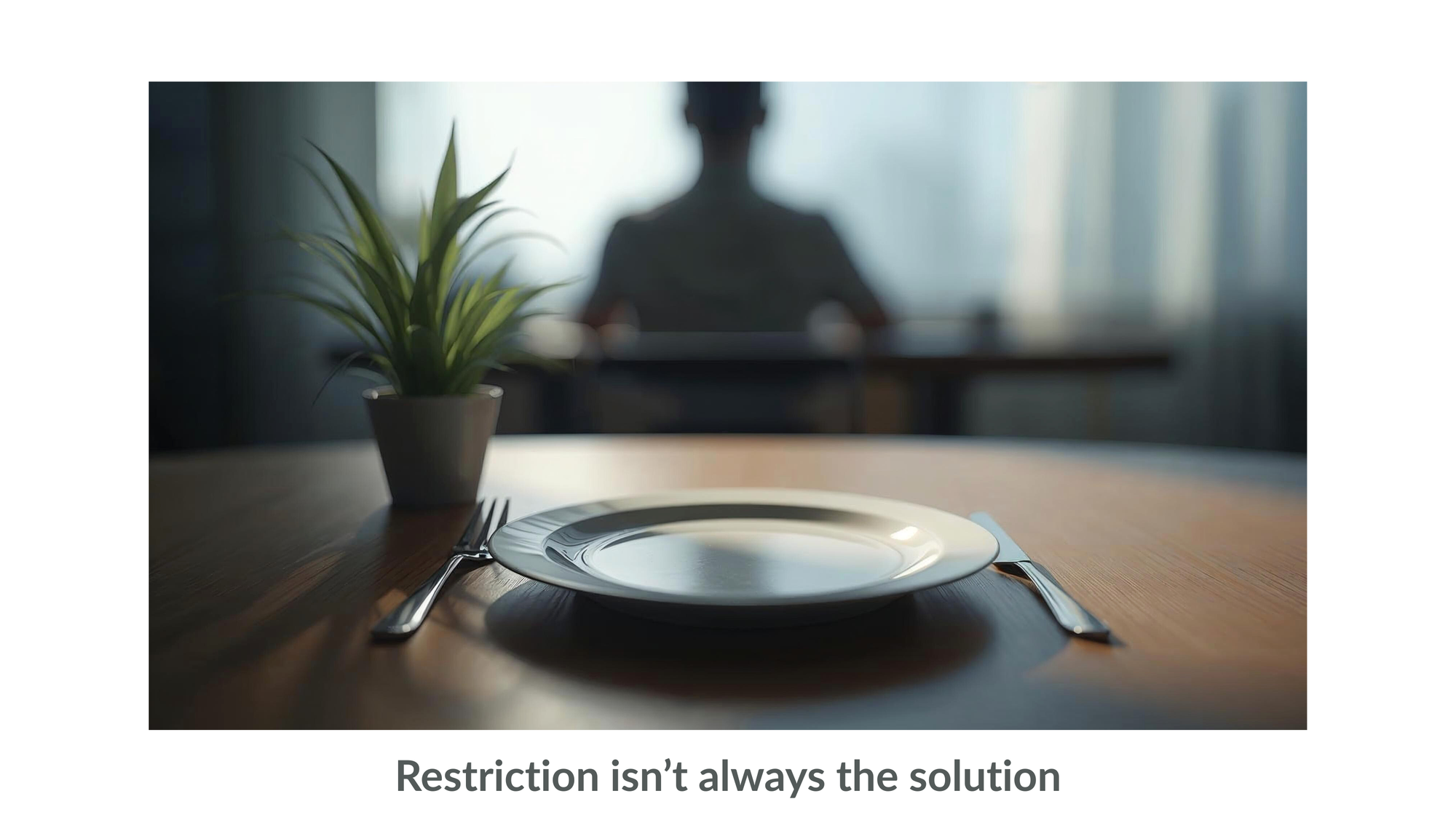 n-article image showing an empty plate on a table with a blurred person in the background, symbolising dietary restriction and stress in a sustainable fat loss article